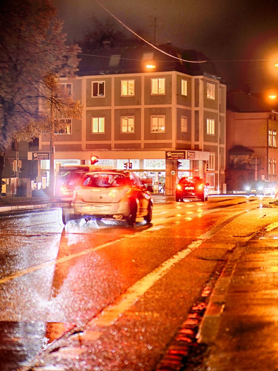 VIEW OF CITY STREET AT NIGHT