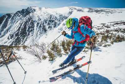 High angle view of people on snowcapped mountain during winter