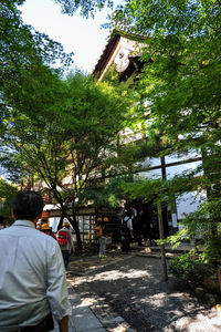 Rear view of people outside building