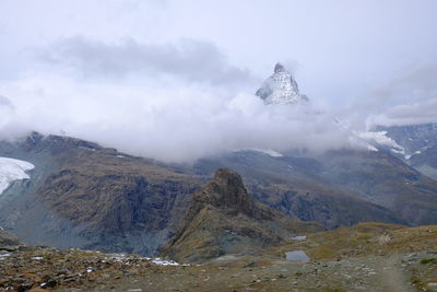Scenic view of snowcapped mountains against sky