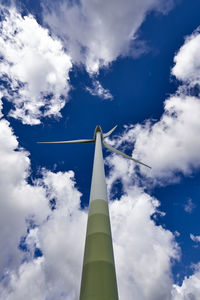 Low angle view of tower against cloudy sky