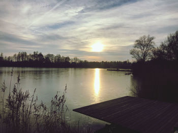 Scenic view of lake against sky during sunset