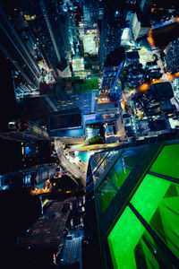 High angle view of illuminated buildings in city at night