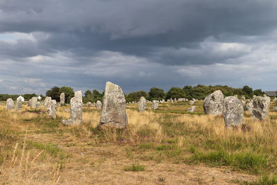 Old ruins on field against sky