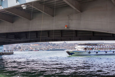 Boats in sea against built structure