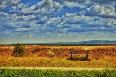 Scenic view of landscape against cloudy sky