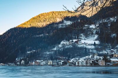 Scenic view of residential district against sky during winter