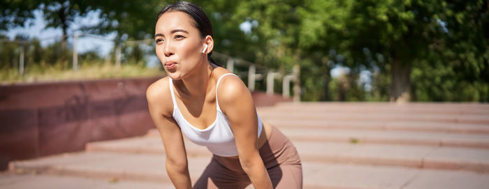 Young woman exercising in gym