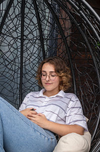 Portrait of teenage girl sitting outdoors