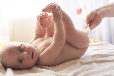 Cute baby lying on bed