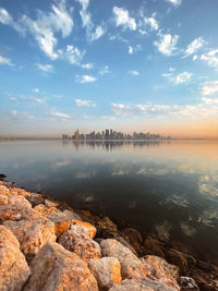 Scenic view of lake against sky during sunset