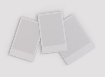 High angle view of papers over white background