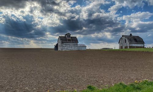 House on field against sky