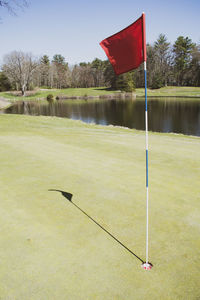 Lifeguard hut on golf course by lake