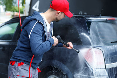 Side view of man working in workshop