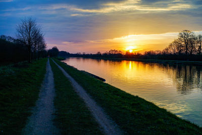 Scenic view of lake against sky during sunset