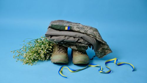 High angle view of hat against blue background