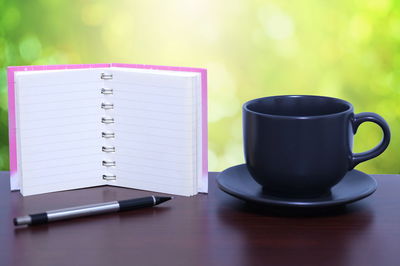 Close-up of coffee cup on table