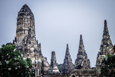 Panoramic view of temple and buildings against sky