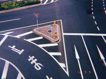 High angle view of arrow sign on road