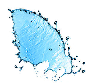 Close-up of water splashing against blue background