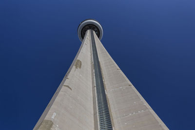 Low angle view of tower against blue sky