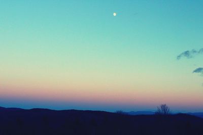 Scenic view of moon against clear blue sky