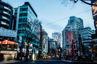 City street and buildings against sky