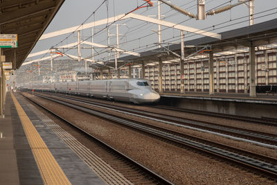 Train at railroad station in city