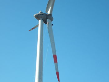 Low angle view of pole against clear blue sky