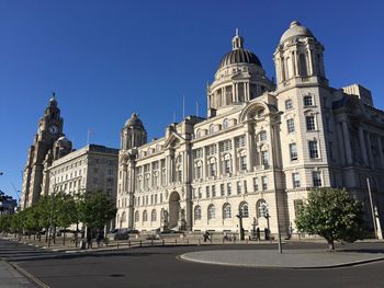 Facade of historic building against blue sky