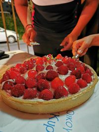 Midsection of woman holding dessert