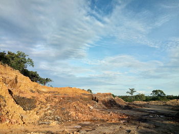 Rock formations on landscape against sky