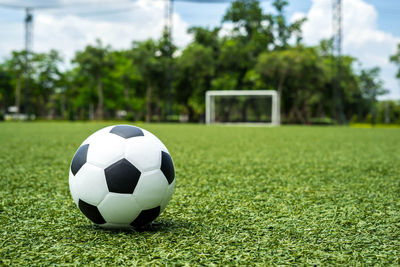 Close-up of soccer ball on field