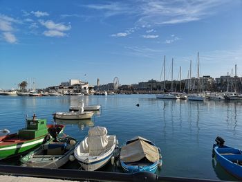 Boats moored at harbor