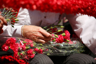 Cordoba,spain  2 may. 2022   battle of the flowers, women dressed in traditional flamenco .