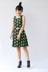 Full length of woman standing against white background