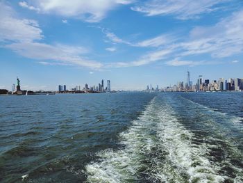 View of the statue of liberty and lower manhattan new york city 