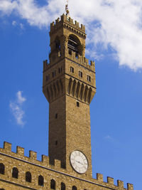 Low angle view of clock tower against sky