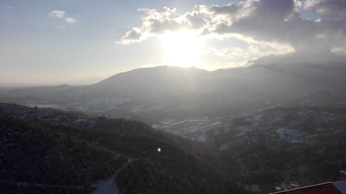 Scenic view of mountains against sky during sunset