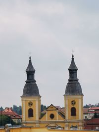 View of buildings against cloudy sky