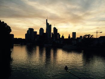 Silhouette of city at sunset