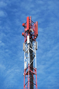 Low angle view of communications tower against sky