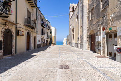 Footpath amidst buildings in town