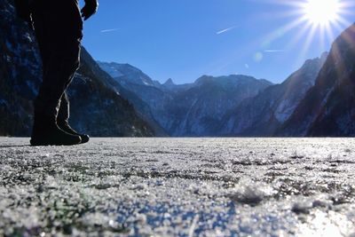 Low section of person on snow covered mountain