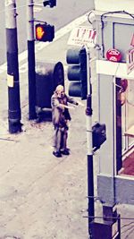 Full length of woman standing on bench