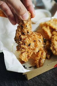 Close-up of hand holding ice cream