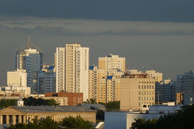 Buildings in city against sky