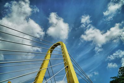 Low angle view of cables against blue sky