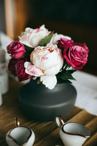 Close-up of pink roses on table